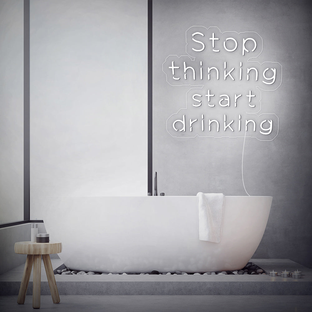 Enseigne néon stop thinking start drinking
